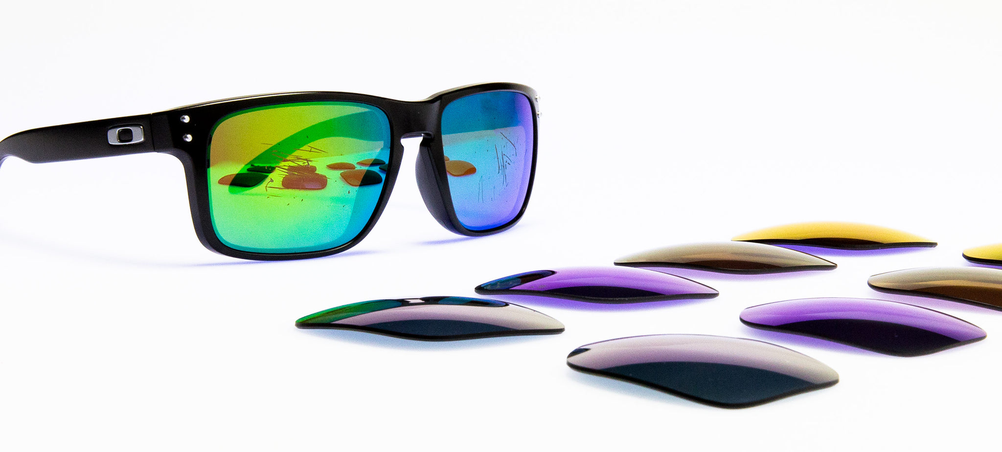 sunglasses with assorted replacement lenses sitting in front